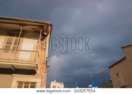 Detail Of An Abandoned Building In Cloudy Sky Landscape