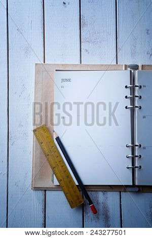 dairy or noote book open page with pencil and ruler