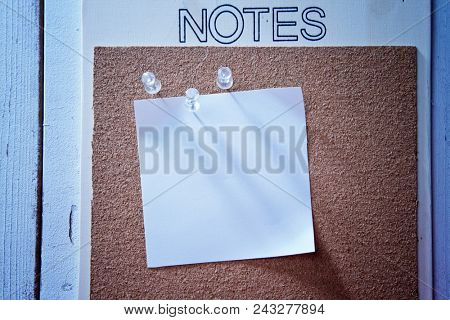blank memo note pad on cork boad