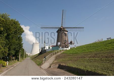 Windmill And Nuclear Power Plant In Doel, Belgium