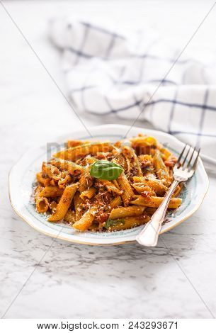 Italian Food And Pasta Pene With Bolognese Sause On Plate