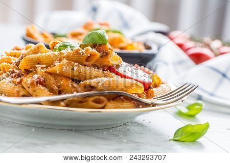 Italian Food And Pasta Pene With Bolognese Sause On Plate