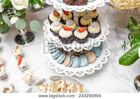Candy Bar. Delicious Sweet Buffet With Cupcakes. Sweet Holiday Buffet With Cupcakes