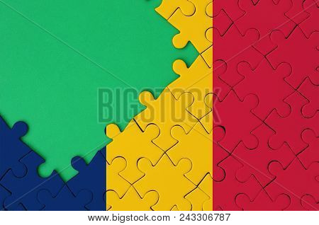 Chad Flag  Is Depicted On A Completed Jigsaw Puzzle With Free Green Copy Space On The Left Side.