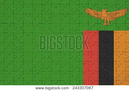 Zambia Flag  Is Depicted On A Folded Puzzle