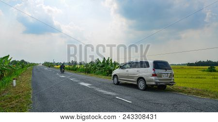 Tien Giang, Vietnam - Aug 31, 2017. A Car Parking On Highway In Sunny Day.