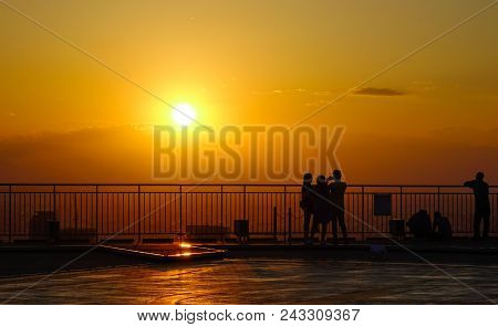 Tokyo, Japan - Apr 5, 2017: People Standing On Skydeck And Looking At The Cityscape In Sunset.