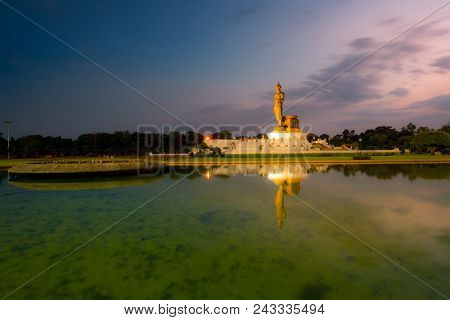 Important Day In Buddha Religion Concept. Big Buddha Statue With Reflection On Water In The Evening 