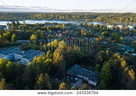 Aerial view of houses in urban-type settlement Nikolskiy and Svir river, Leningrad region, Russia.