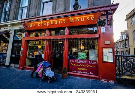 Edinburgh, Scotland - April 2018: Woman With Trolley Walks By The Elephant House Cafe, Made Famous A