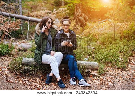 Two Beautiful Girls Sat Down To Rest In The Forest