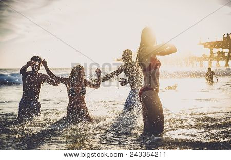 Friends Playing In The Ocean