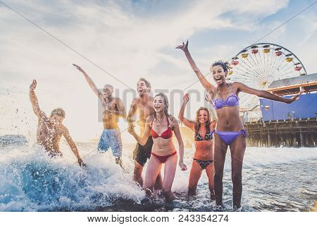 Friends Playing In The Ocean