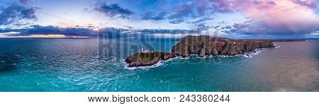 Aerial View Of South Stack With Lighthouse During Sunset.