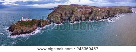 Aerial View Of South Stack With Lighthouse During Sunset.