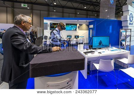 Berlin - April 26, 2018: The Stand Of Roscosmos. Demonstration Of The Operation Of The Hardware-soft
