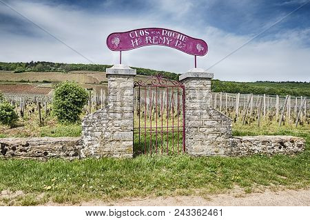 Morey-st. Denis, France - April 23, 2018: A Stone Gate With A Purple Sign Showcases The Clo De La Ro