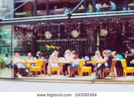 Colorful Blurred View Of The City Center Street Cafe Interior. De Focused Backdrop Depicts A Sunny V