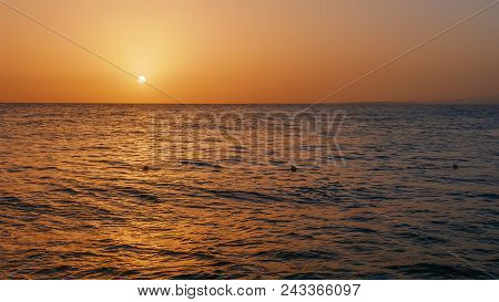 The Sun Sets Over The Sea At Sunset