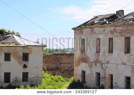 Two Demolished Mystical Buildings. An Abandoned Old Castle. Bright Summer Day.