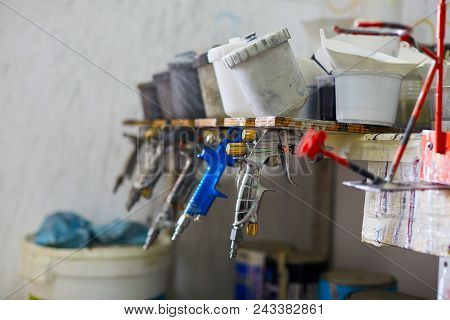 Mechanic Preparing The Paint For The Bodywork Of A Car In Special Garage