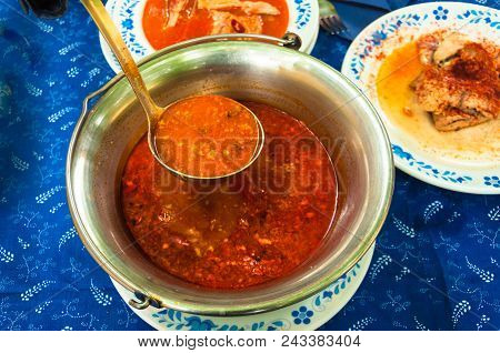 Traditional Hungarian Fish Soup In Bogrács With Paprika