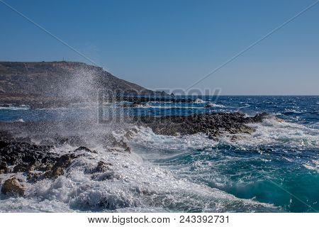 Photo Of Sea Water Beating Against Rock, Cirkewwa, Malta