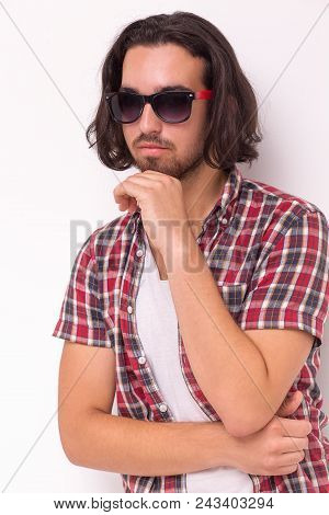 Half Length Portrait Of Boy Wearing Sunglassess. Looking Side Away.