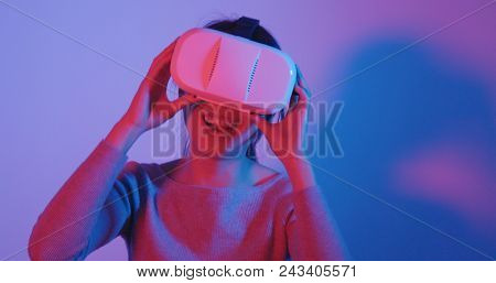 Woman look though the VR device 