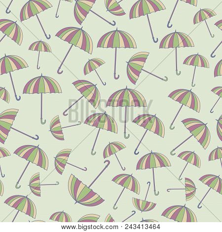 Seamless Pattern With Cute Cartoon Umbrellas On Light Green Background