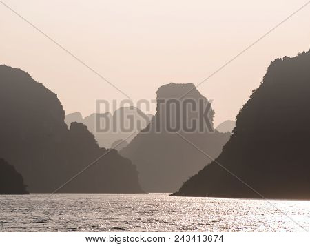 Silhouette Of Rocks In The Sea At Sunset In Vietnam