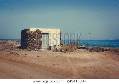 Scenic View Of Pedro Barba Village Under A Sky With Clouds. Ocean On The Background. La Graciosa, La