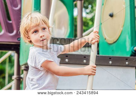 Funny Cute Happy Baby Playing On The Playground. The Emotion Of Happiness, Fun, Joy.