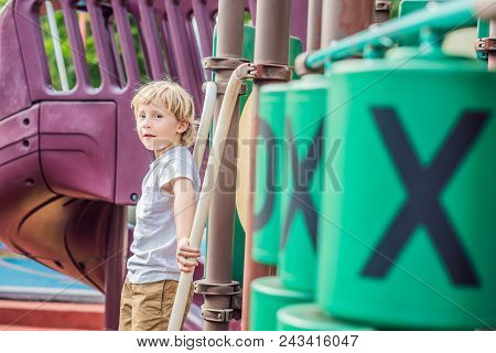 Funny Cute Happy Baby Playing On The Playground. The Emotion Of Happiness, Fun, Joy.