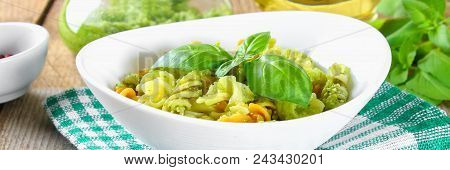 Pasta With Pesto Sauce On An Old Wooden Table
