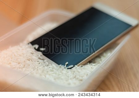 Water Damaged Phone In A Box Of Rice