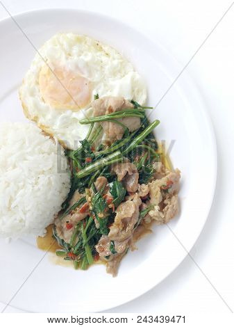 Stir Fried Morning Glory (pad Pak Boong) With Pork And Thai Fried Egg On Top Of Hot Rice In White Di