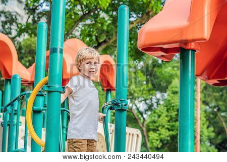 Funny Cute Happy Baby Playing On The Playground. The Emotion Of Happiness, Fun, Joy.