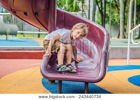 Funny Cute Happy Baby Playing On The Playground. The Emotion Of Happiness, Fun, Joy.