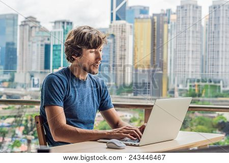 Young Man Teaches A Foreign Language Or Learns A Foreign Language On The Internet On Her Balcony Aga