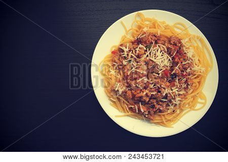 Appetizing Spaghetti In A Plate With Bolognese Sauce On A Dark Background Close Up And Copy Space