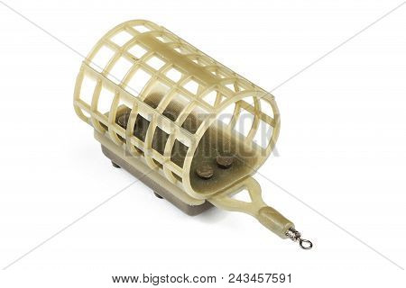 Brown Feeder Fishing Flat On An Isolated Background. Fishing Tackle Made With Plastic