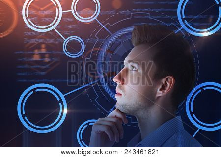 Thoughtful Young Businessman With Digtal Business Interface. Technology, Innovation And Future Conce
