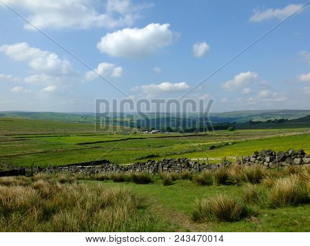 Scenic View Of A Path On The Edge Of Moorland In Calderdale West Yorkshire With Rough Tussock Grass 