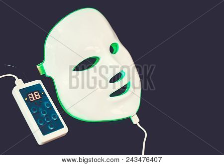 Light Rejuvenating Mask For Facial Skin Therapy On Black Background