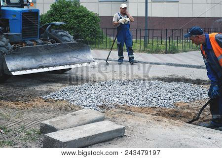 Road Works, Closing Holes In Asphalt And Workers June 2, 2018, Russia, Leningrad Region City Of Kiro