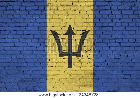 Barbados Flag Is Painted Onto An Old Brick Wall