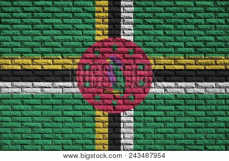 Dominica Flag Is Painted Onto An Old Brick Wall