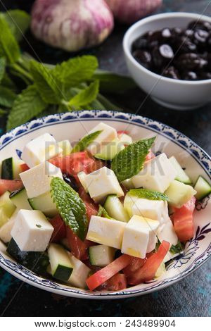Greek salad with feta cheese cubes and fresk vegetables