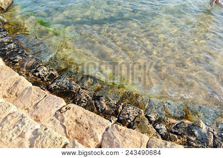 Old Ancient Yellow Stone Steps Covered With Brown Friable Sand With Waves And Irregularities, Descen